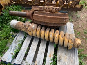 John Deere 850J Recoil Spring Assemblies, Idlers, Track Guards and Rollers.